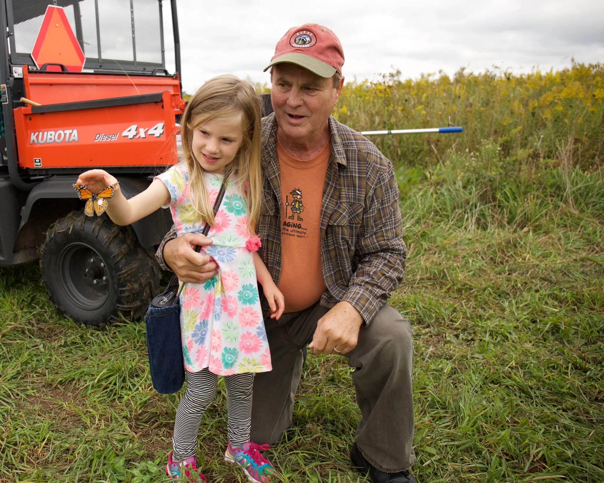 Bob and his granddaughter releasing a newly tagged monarch at Goose Pond in 2016. Photo by Arlene Koziol