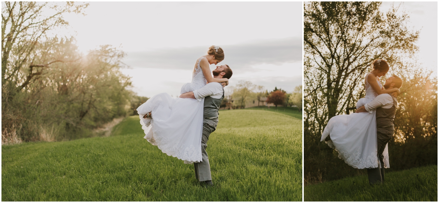 groom carrying the bride