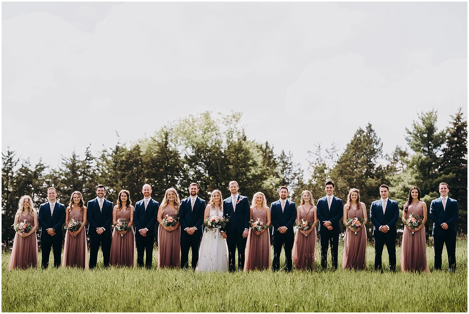 the bridal party with the bride and groom