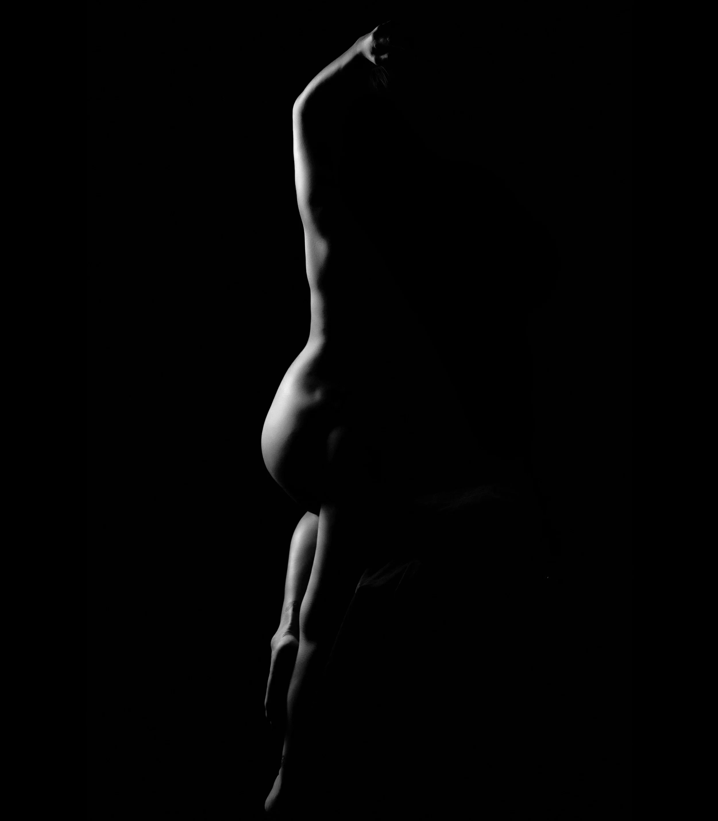 Close up of woman's body in studio lighting