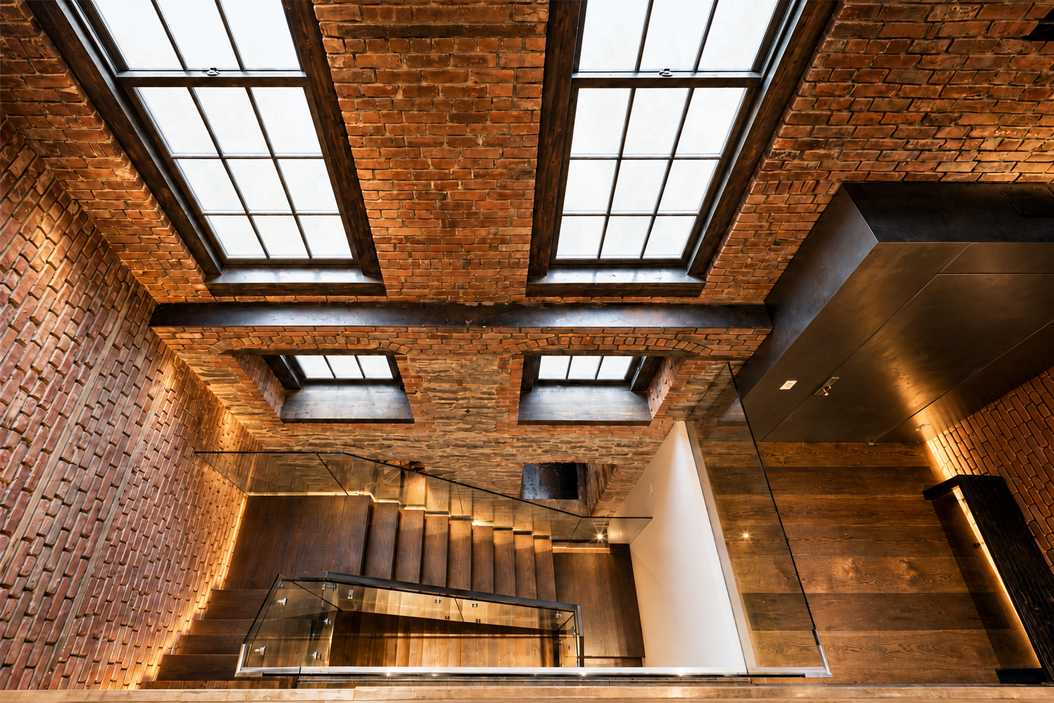 1. Luminous skylights over a brick stairwell.png