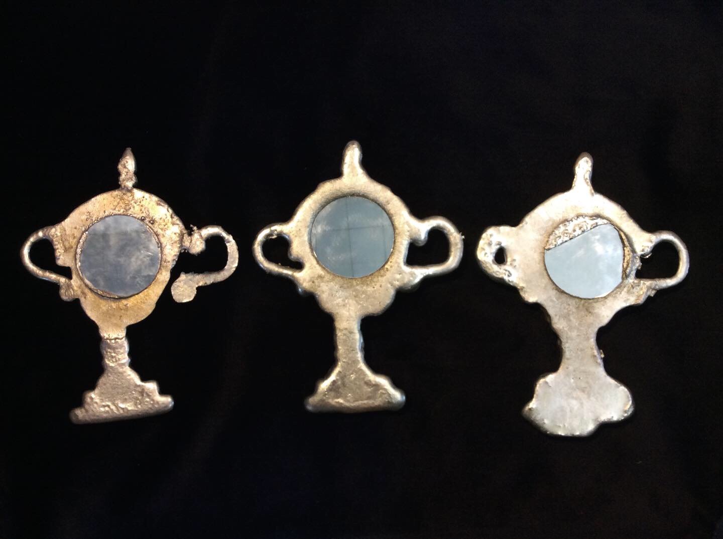   mourning mirrors , edition of 3, 2023, pewter, bismuth, and glass, 6 x 4 inches (reverse) 
