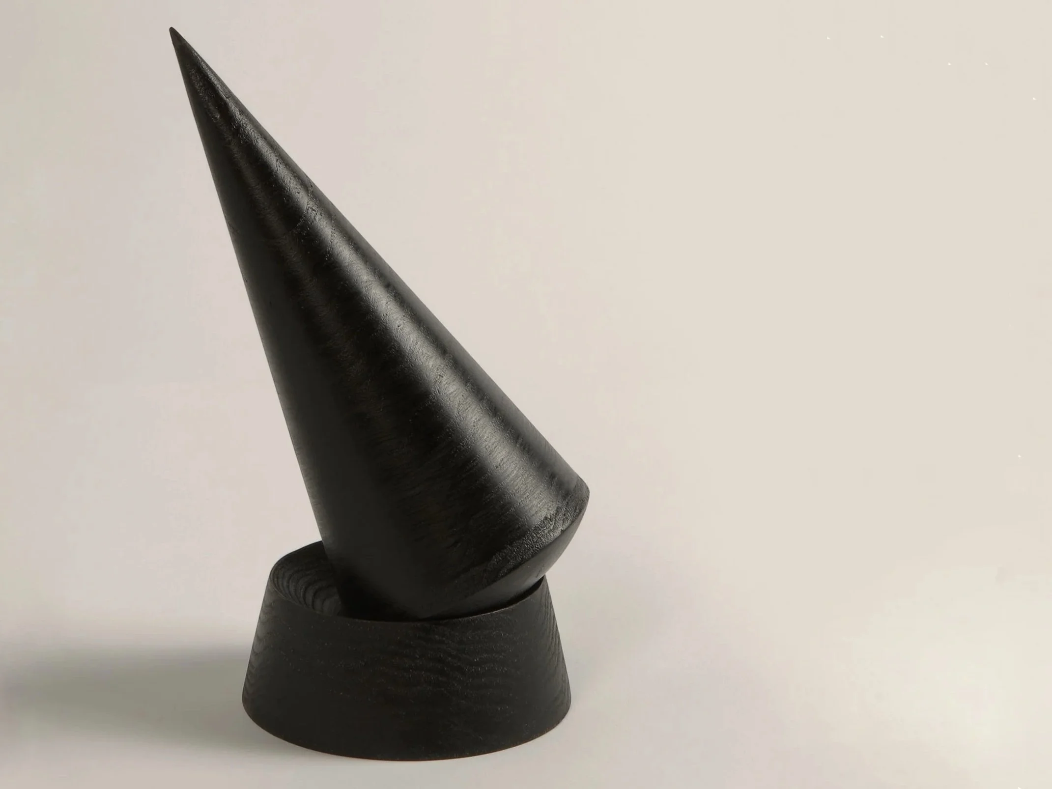 Keilir sculptural pestle and mortar in black stained wood inspired by Icelandic mountain forms