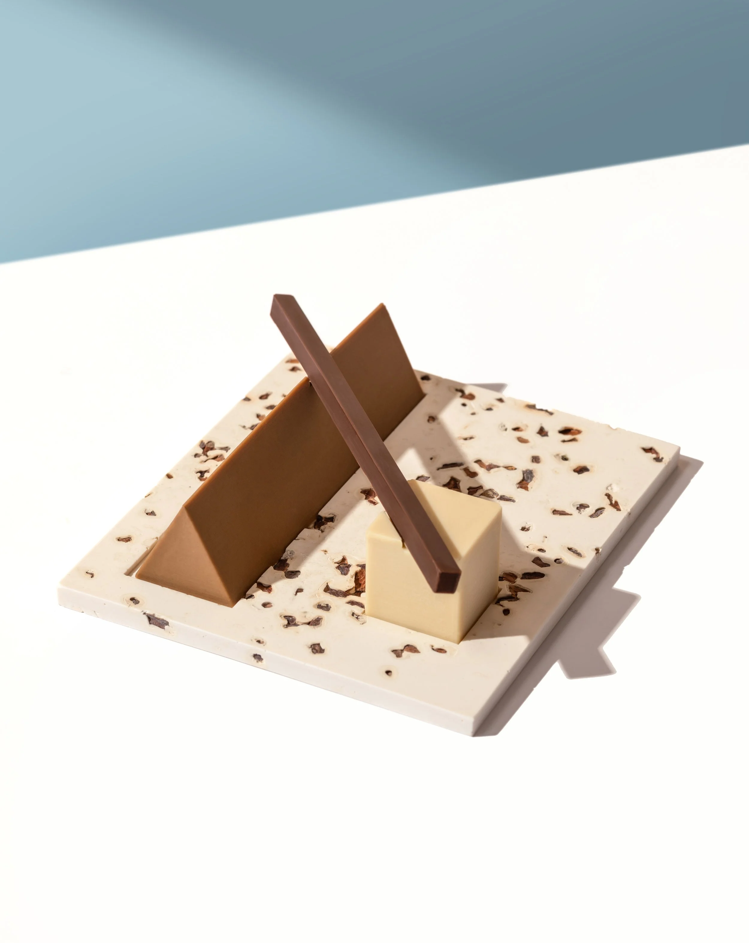 Geometric chocolate composition featuring intersecting sculptural forms in immersive edible installation for Omnom