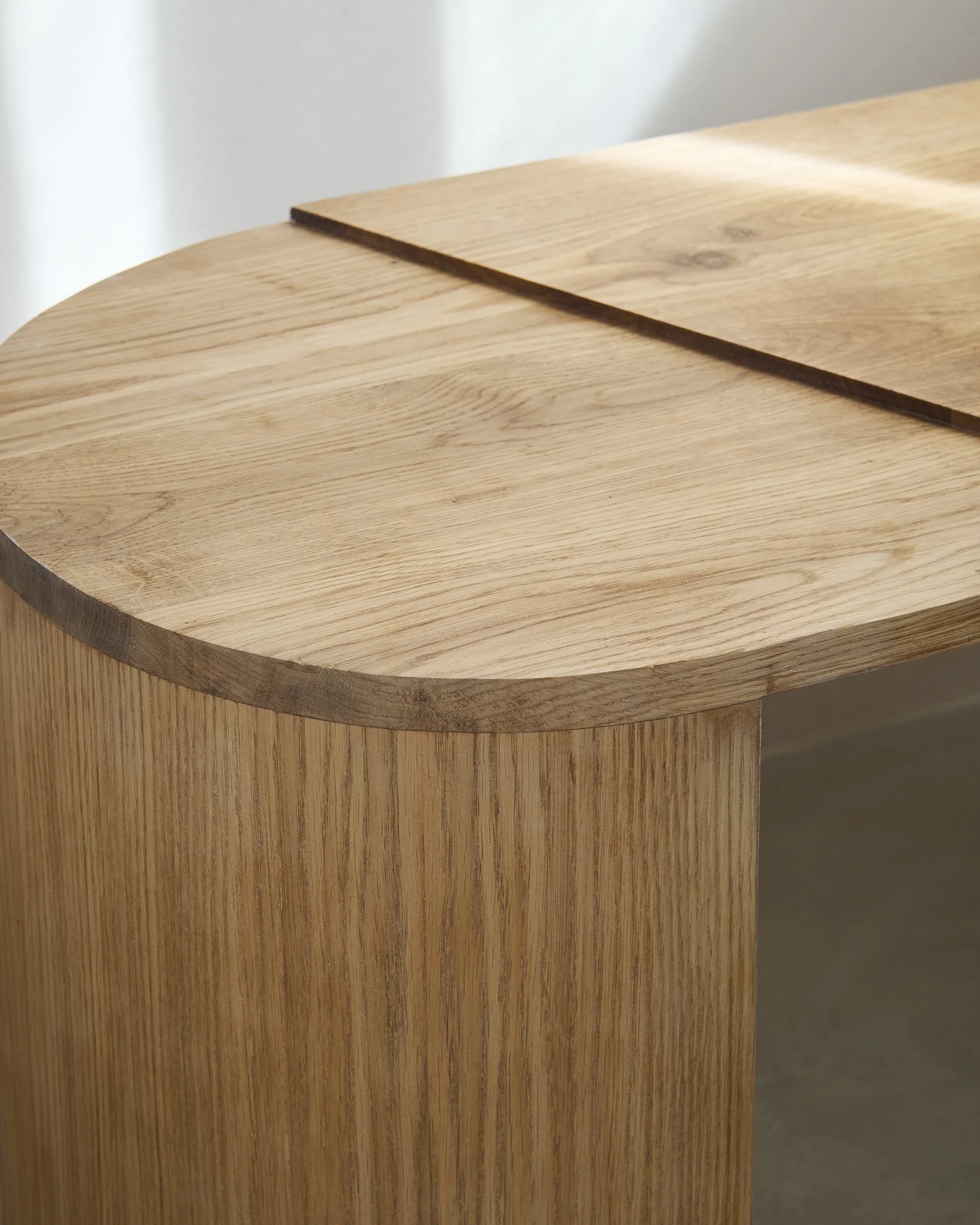 Detail of contemporary sculptural oak bench design