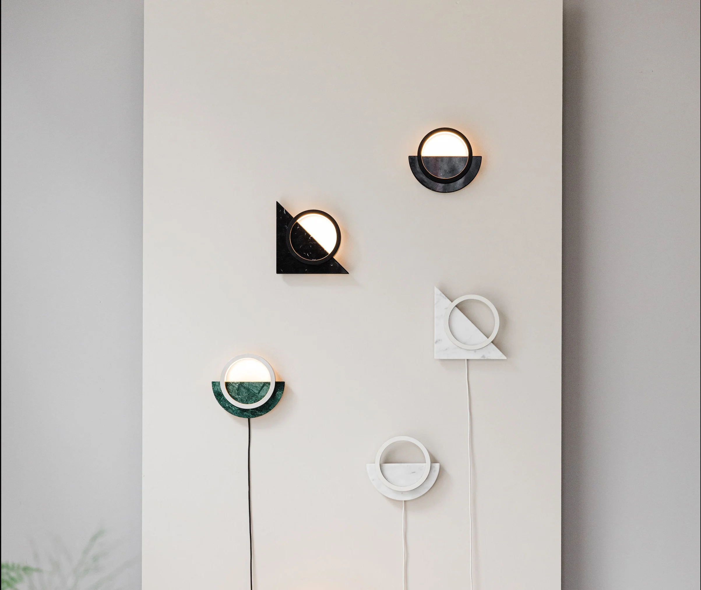 Assorted Composition Light wall and table lamp variations displayed in interior setting