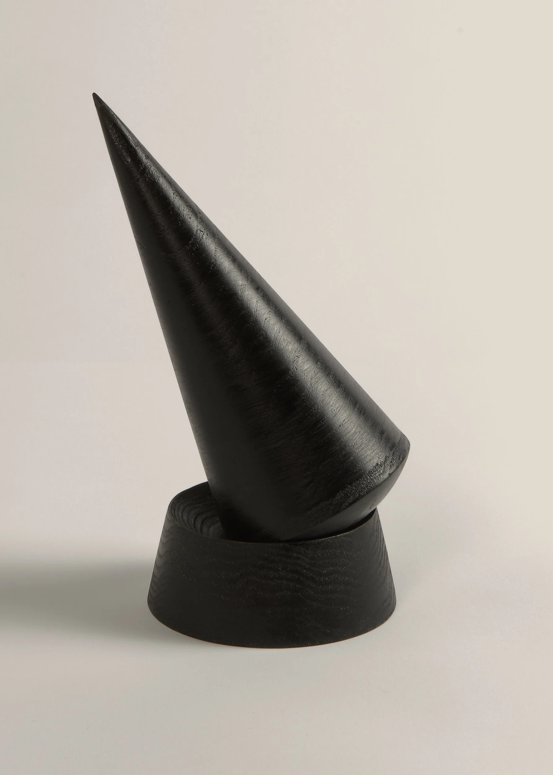 Keilir pestle balanced on mortar base in sculptural conical form