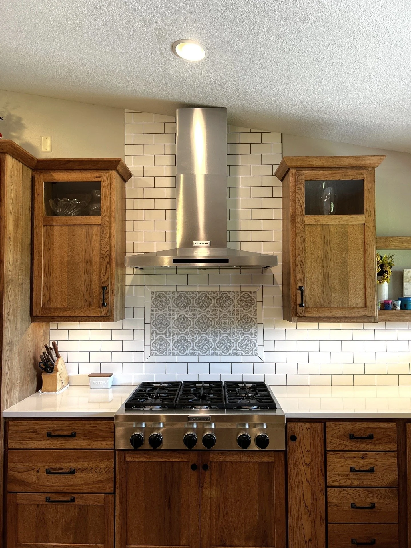 Custom hickory kitchen designed to fit the space, featuring floating shelves, solid surface countertops, and stainless steel appliances. Thoughtful details throughout make this kitchen both functional and inviting.

#customkitchen #customcabinetry #h
