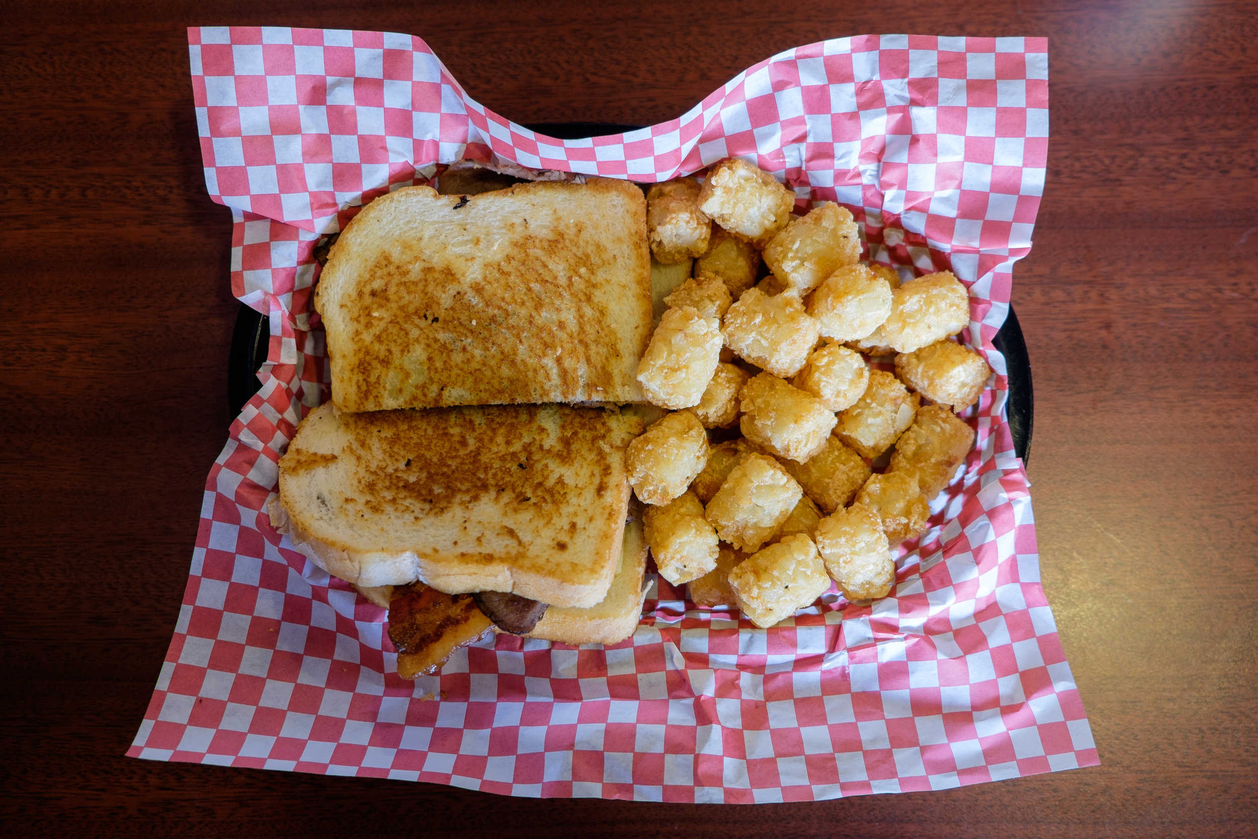 Grilled cheese with bacon and a side of tots. Classic.