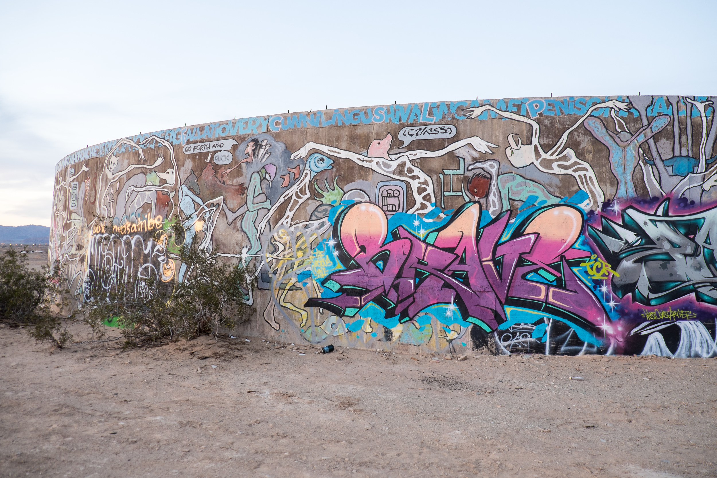 A short walk away, you will find this graffiti. It's incredibly vulgar and a stark contrast to Salvation Mountain.