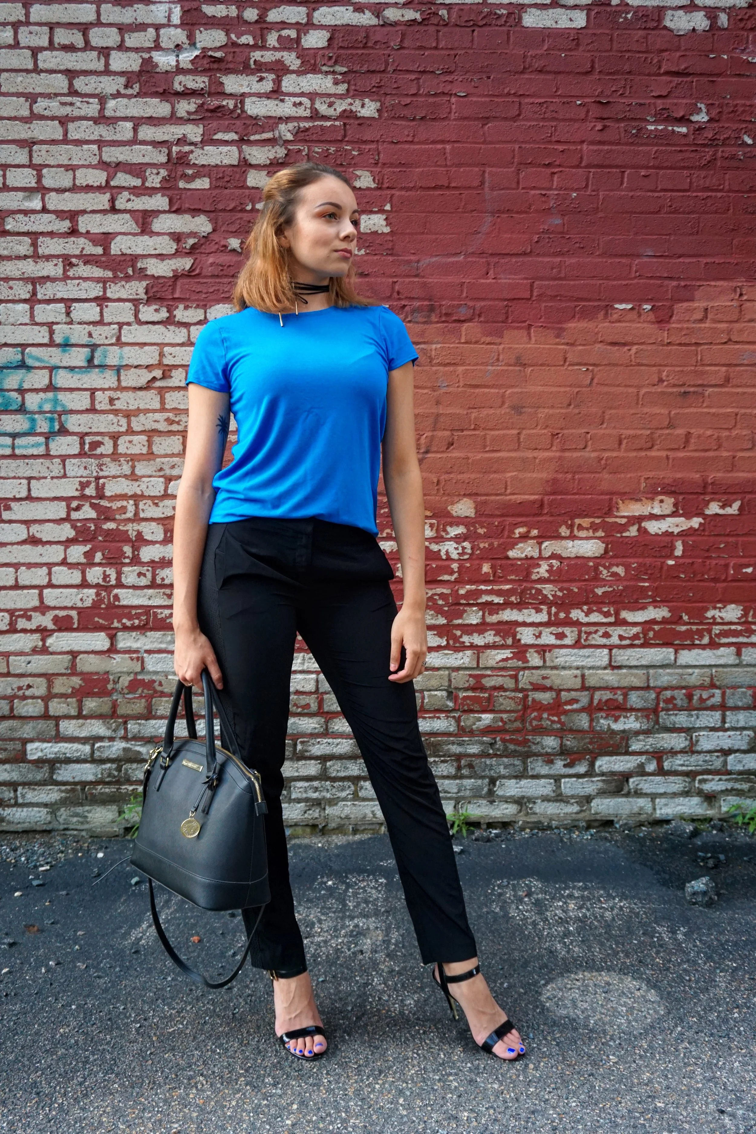 blue top black pants outfit