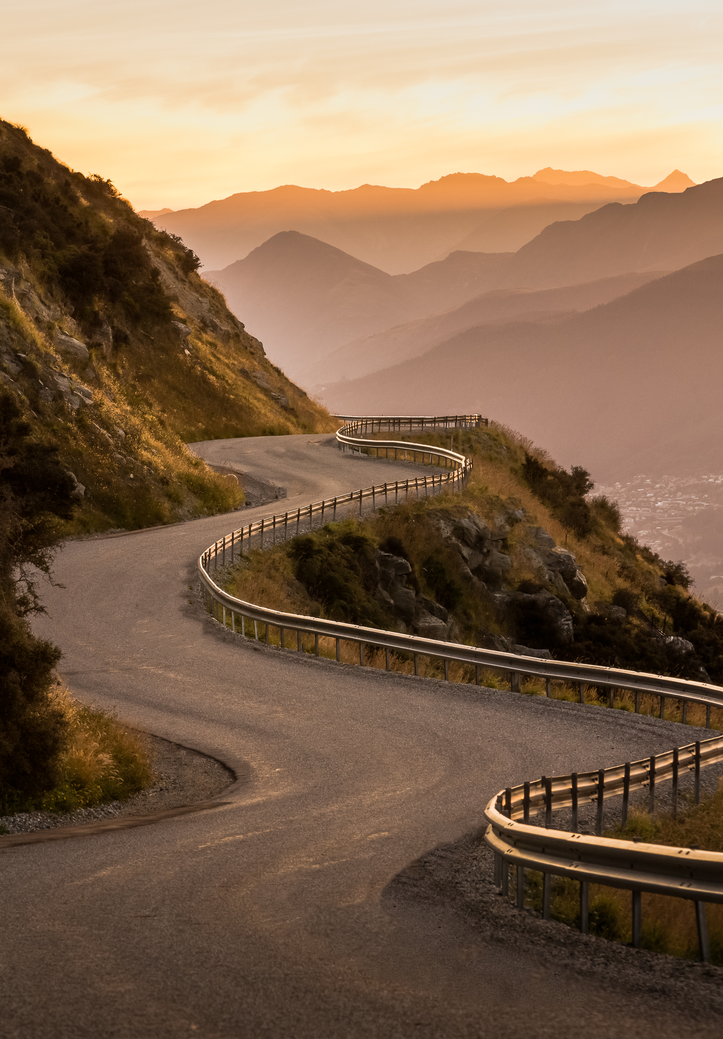 new-zealand-landscape-queenstown-winding-road-sunset.jpg