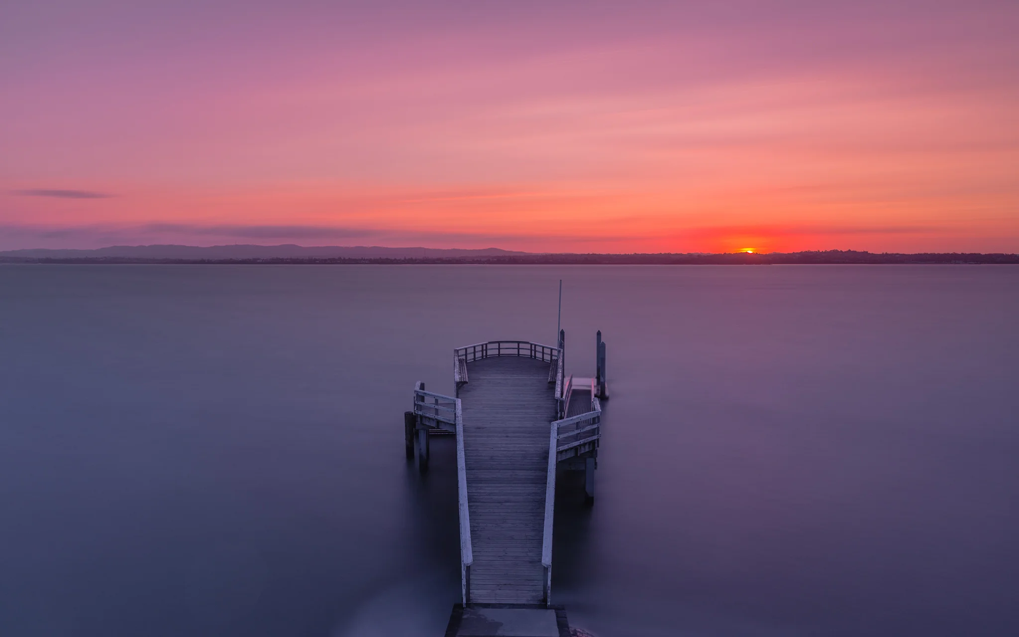 new-zealand-landscape-beach-haven-island-bay-wharf-sunset.jpg
