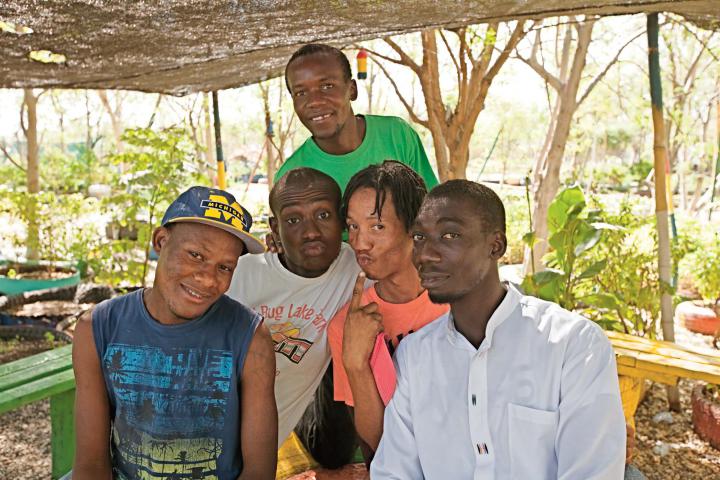 Through a new MCC-funded video, actors and comedians (from left) Luckmane Charles, Edoine Jean Marck, Josue Francois, Ronald Jean Batiste and Ezaie Simon use humor to share and promote earthquake-resistant building techniques. (See photo below from the video.)