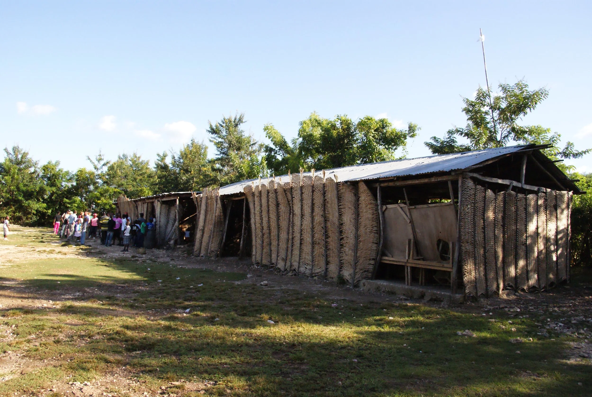 Children hang around outside the Kids Club after their story and singing time ended for the day. MCC supports this after-school program where children learn about nutrition, creation care and are sometimes served nutritious snacks. Photo credit: Tina Schrag
