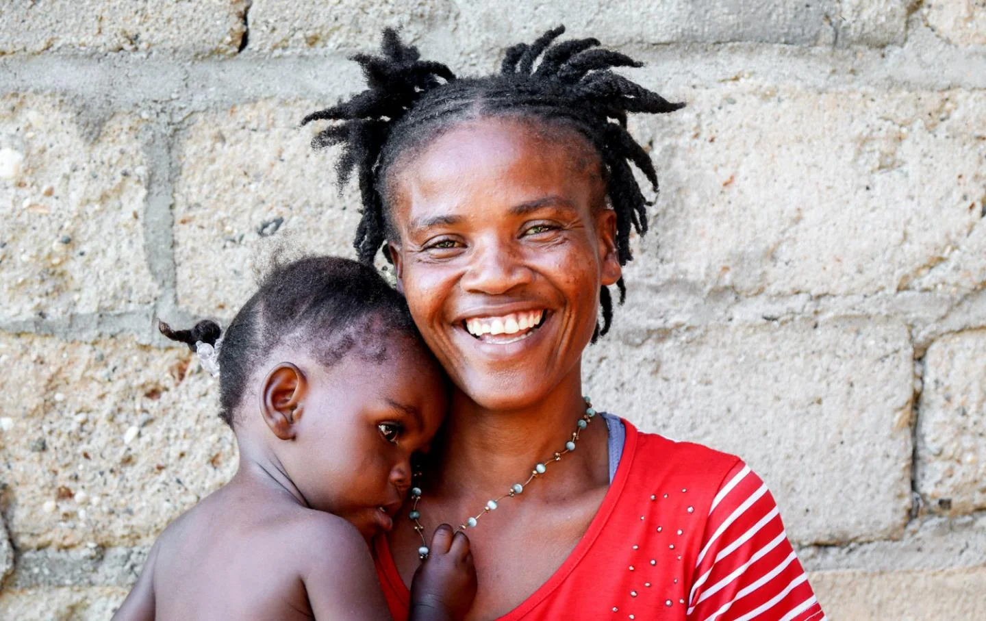 Louis Vesta and her 14-month-old daughter Wilda Owasen are participants in MCC’s mobile child malnutrition clinic in Degrave, Haiti.