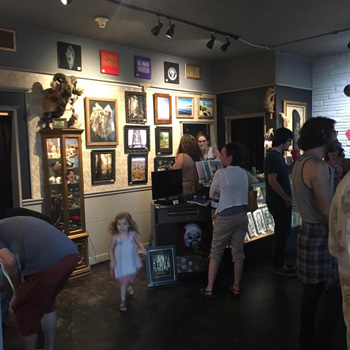 Photo from the recent Skateboard Art Show to benefit the Flow Intitutive at Serpents of Bienville
