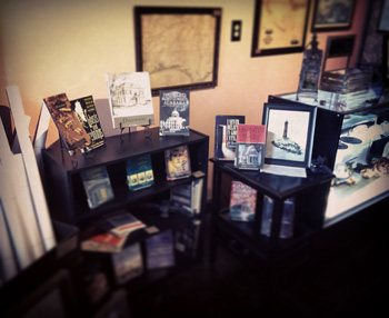 Photo of the inside of the new Serpents of Bienville Space, a shot of just some of the books available for you to take home. Books range from ghost stories, southern folklore, and local history.