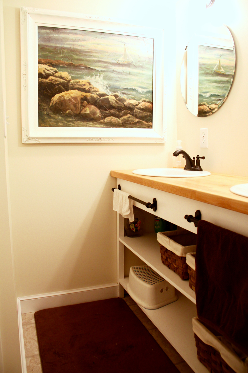 Bathroom with Open Shelves and Large Painting