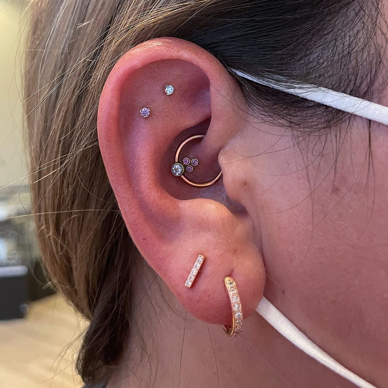 I&rsquo;m a sucker for a good color scheme and Ashley knocked it out of the park here&mdash;choosing arctic blue and amethyst pieces for her double flat that perfectly complement the periwinkle and lilac in her daith piece. Both studs and daith are f