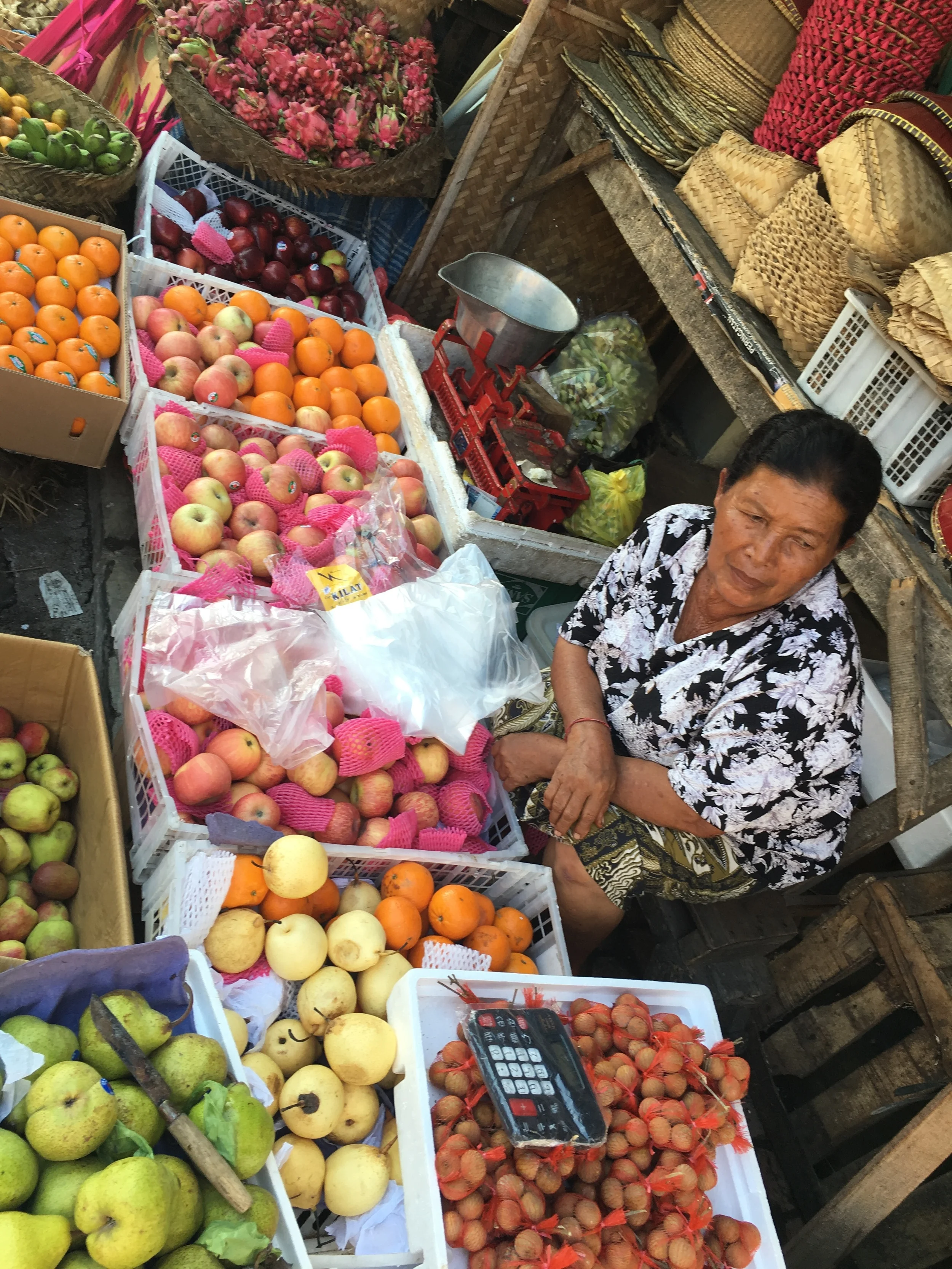 This seller has many different kinds of fruits available. We tried a mangosteen. Good stuff!