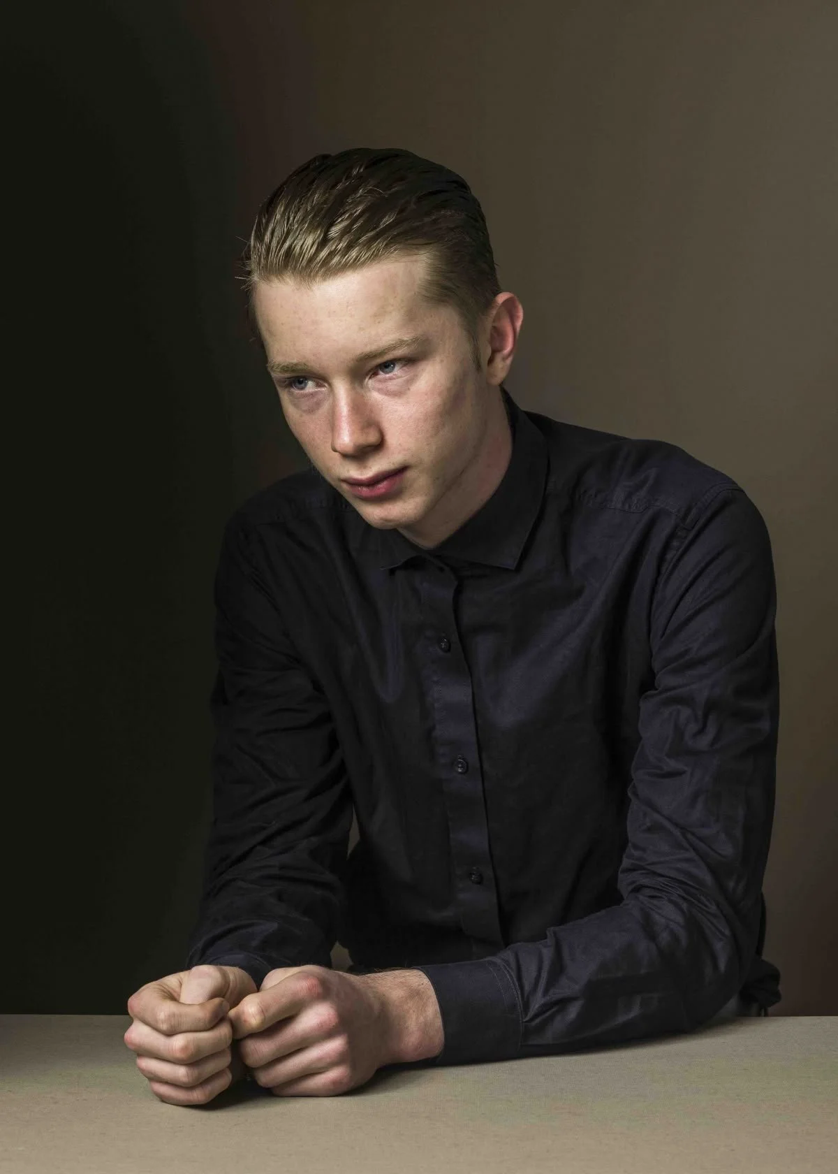 Portrait of man clenching his hands