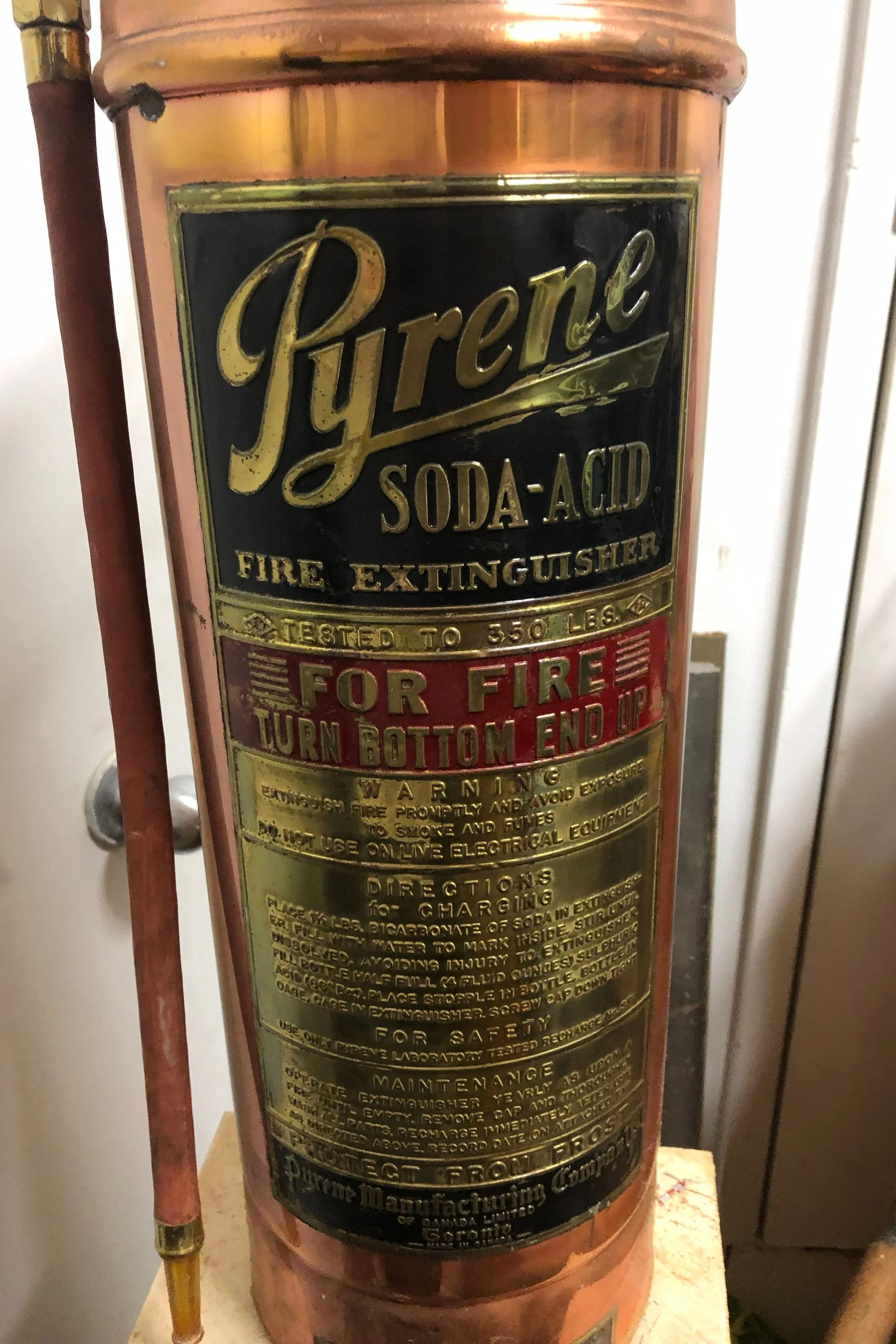 Antique brass fire extinguisher