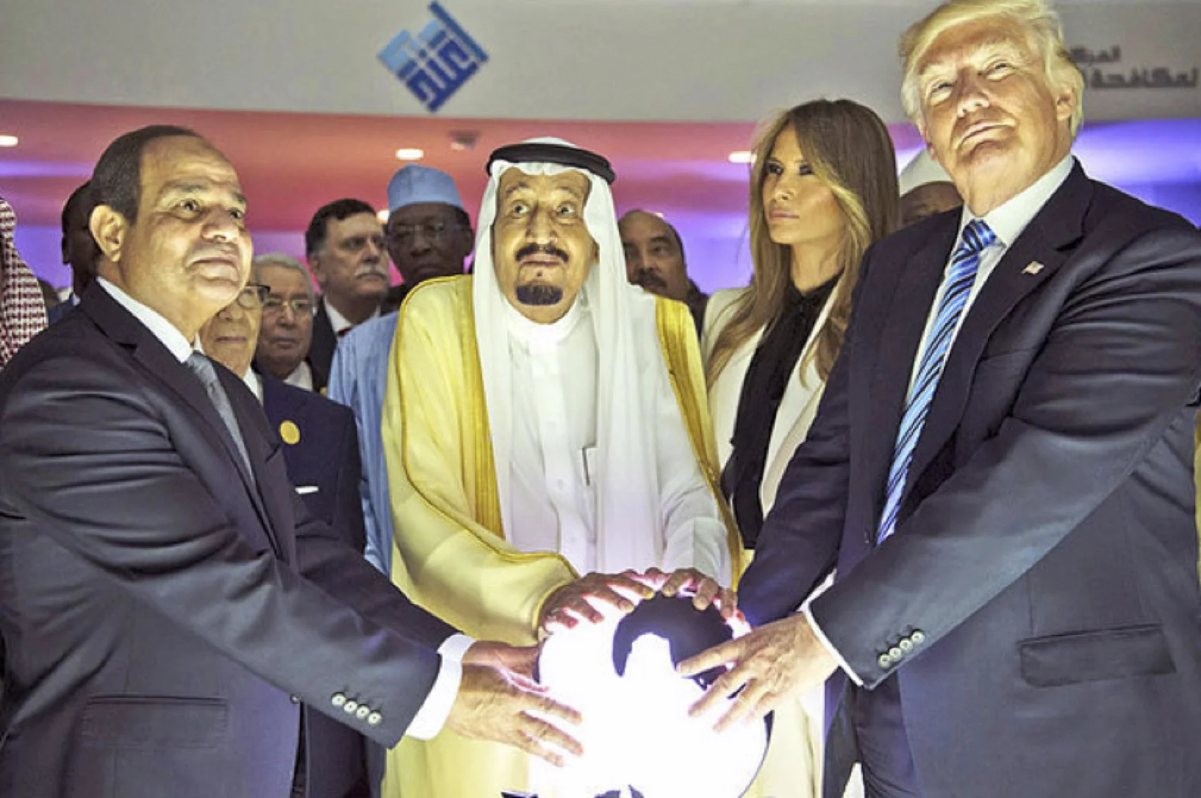 Of all the images, cartoons, and photos of Trump in his first year, this wins the Gropers of the World first prize. President Abdel Fattah el-Sisi of Egypt, King Salman of Saudi Arabia, and Melania and Donald Trump, with a globe in the Global Center for Combating Extremist Ideology in Riyadh, May 2017.