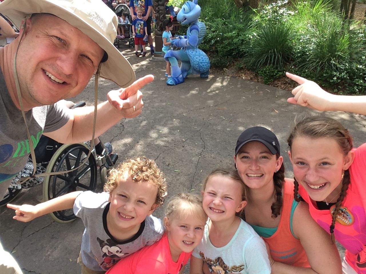 Family selfies! We decided that waiting in line to meet the characters was just our thing, but if we saw one out and about we would take a family selfie with the character in the background.