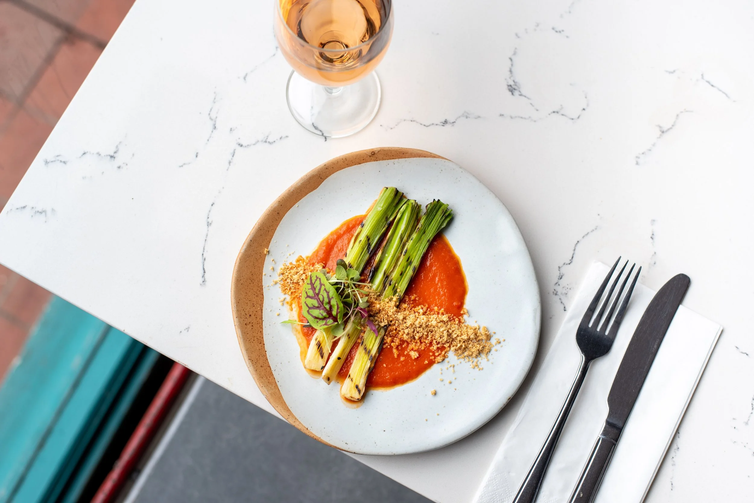 Smoked Leeks with Roasted Garlic Yogurt & Sichuan