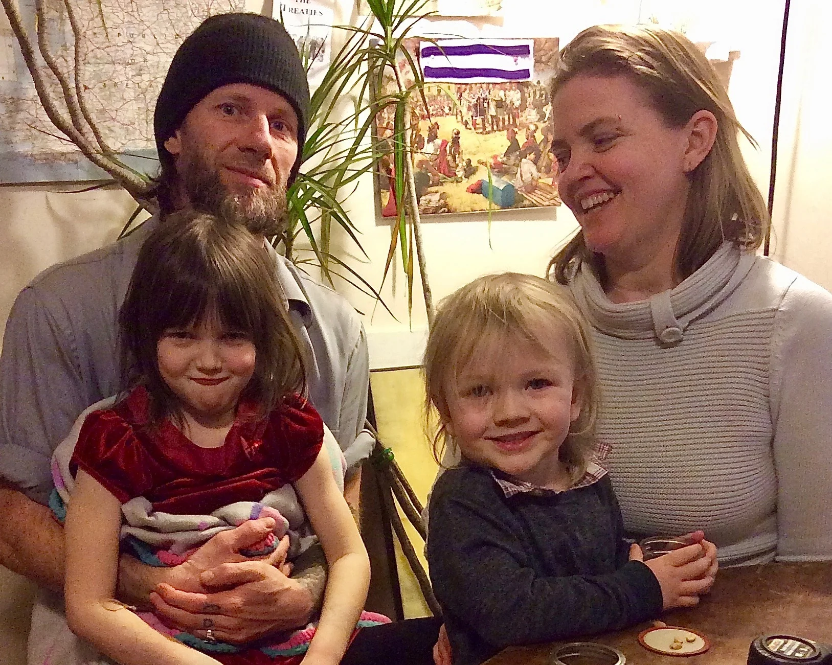 Aislyn Colgan and Harry Pruyne pose with their children Emerald and Padrick. In winter of 2018, Aislyn had work done on her home at a reduced cost through EmPower New York, a state program that helps subsidize energy work. Photo courtesy Sustainable Tompkins .