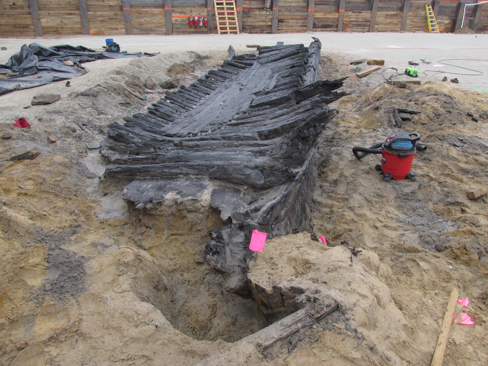  The remnants of the port side of an 18th-century ship purposely positioned against a circa 1798 bulkhead wharf.    