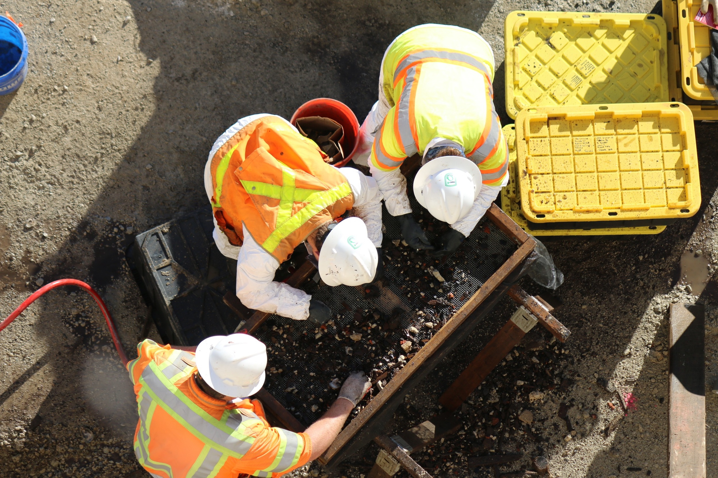   Dan Baicy, Kate Mott and Vince Gallacci water screening privy soils.        