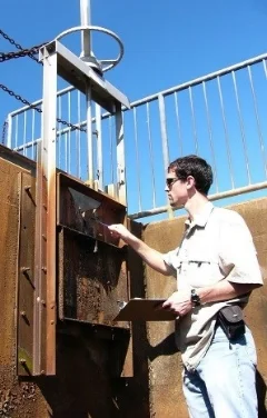 WSSI engineer inspecting a dam.