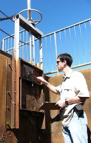 WSSI engineer inspecting a dam.