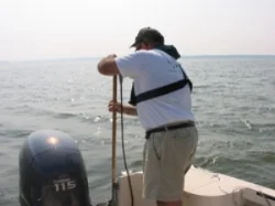 WSSI staff conducting survey by boat in deeper water.