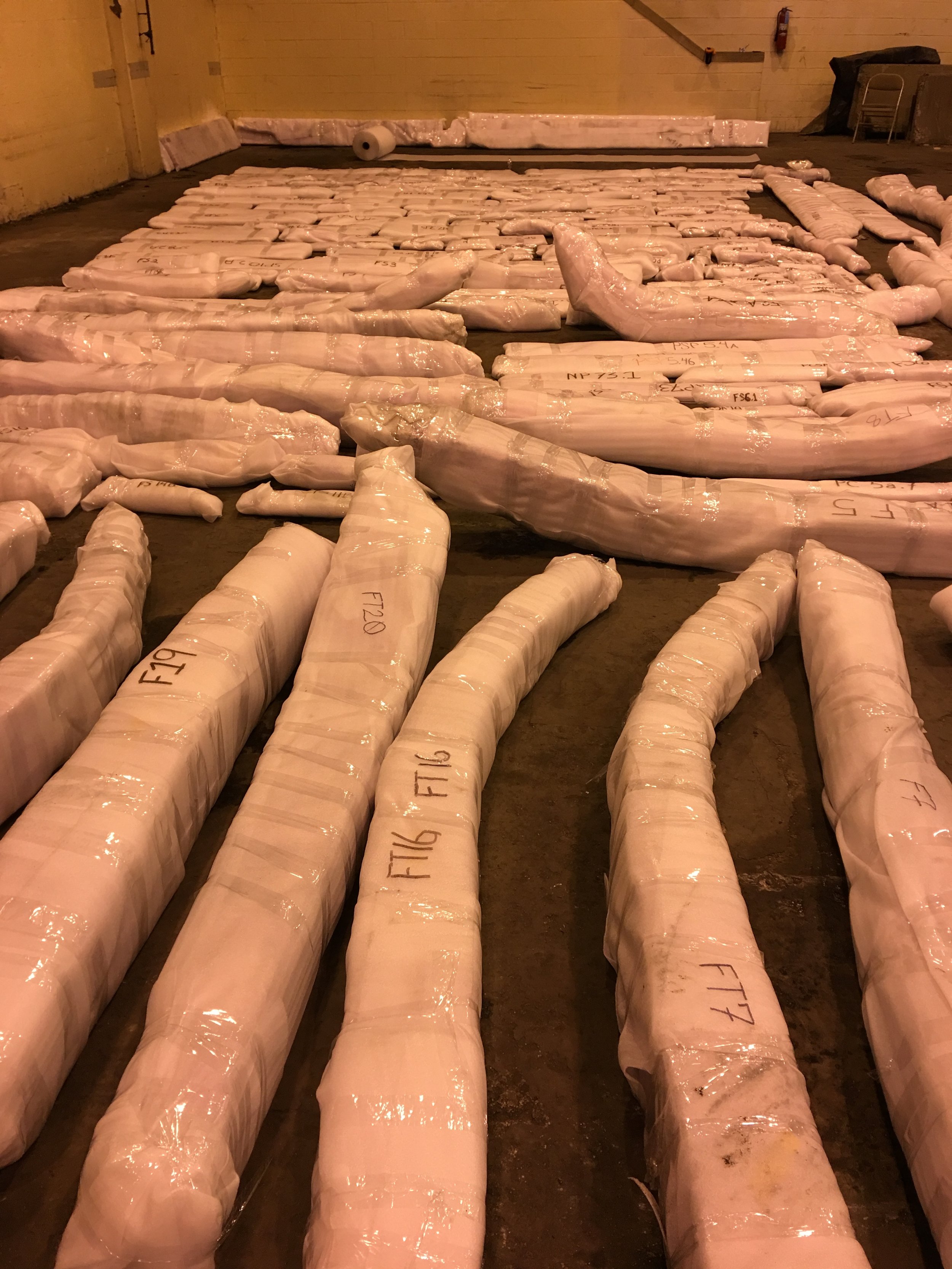  WSSI staff and other volunteers from  Friends of Alexandria Archeology  carefully wrapped timbers for shipping to the conservation laboratory.&nbsp; 