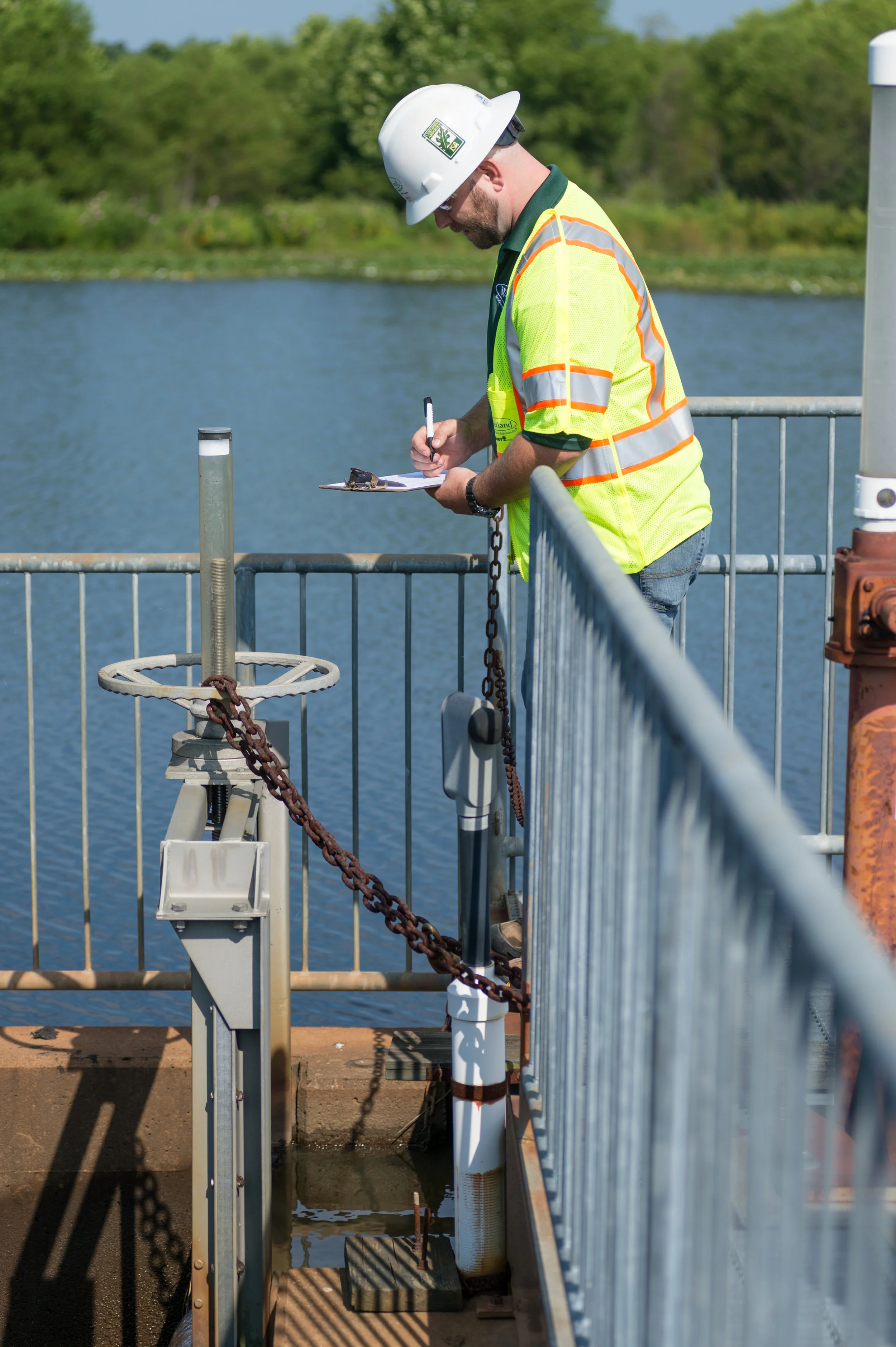 WSSI staff inspecting a dam.