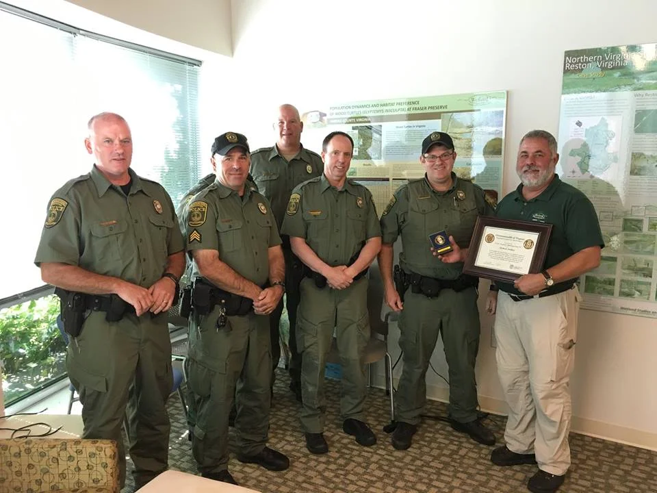 Virginia Conservation Police Officers presented Mike Rolband with the Protector Challenge Coin to recognize his commitment to the Virginia Department of Game & Inland Fisheries’ mission and work.