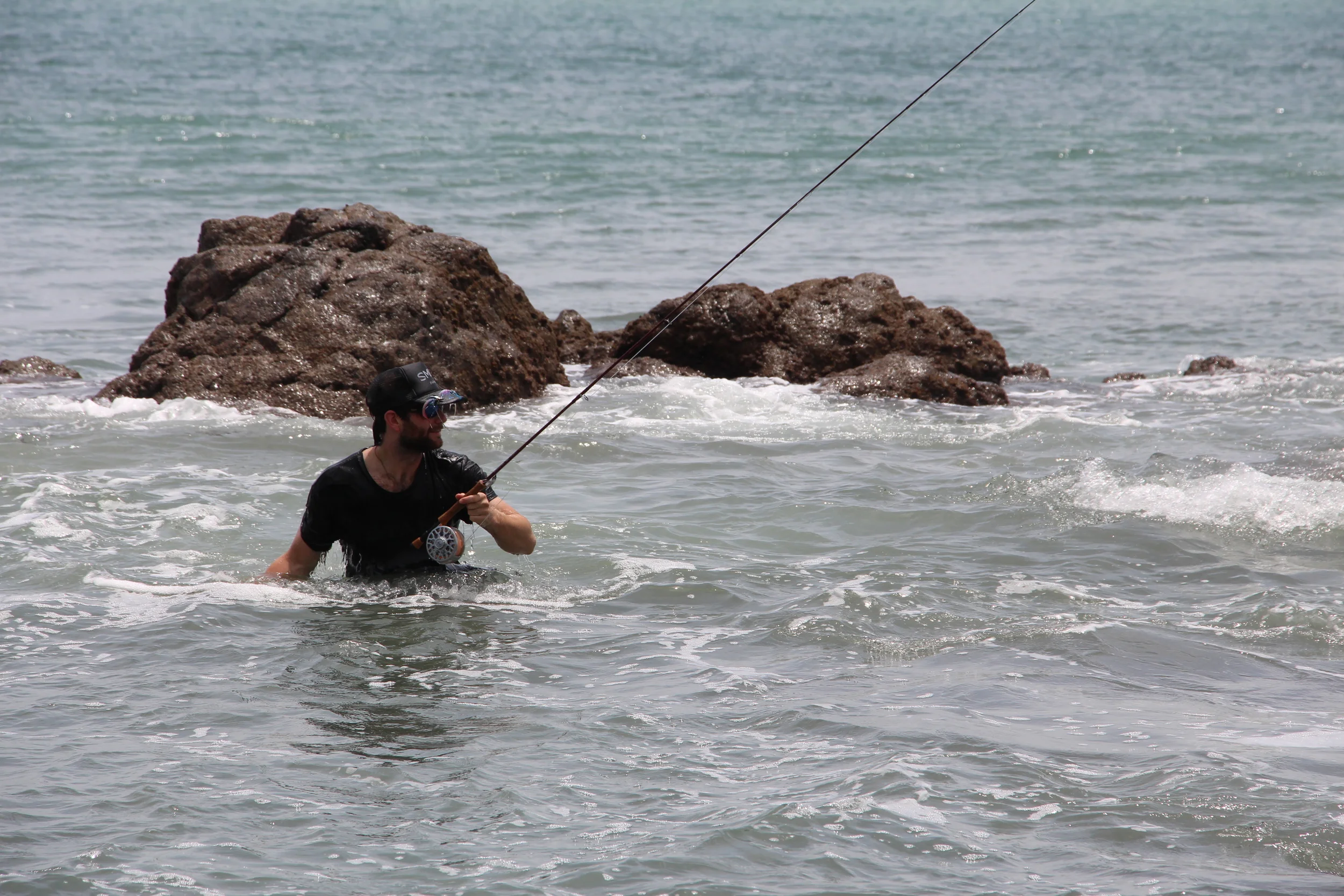 Our reels are meant to be abused. This was just after a set wave blew us off the out cropping; no broken rods or bones...just a few scrapes. 