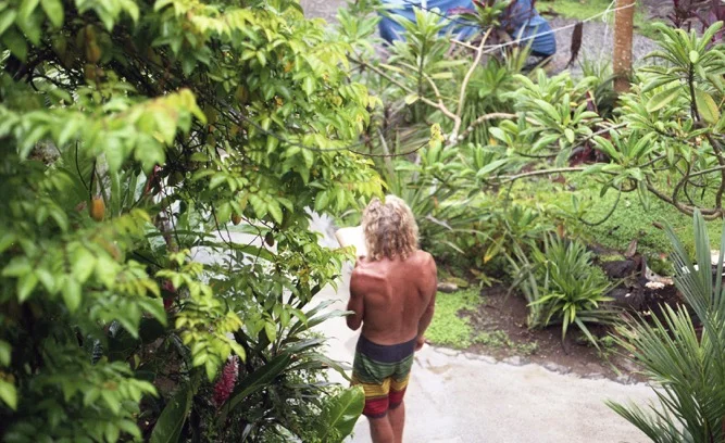 "The Wizard" as we called him doing his morning routine. He got up at first light every day, surfed the right tide, and came back to the hostile to crush cigarettes and coffee all day never putting his book down. 