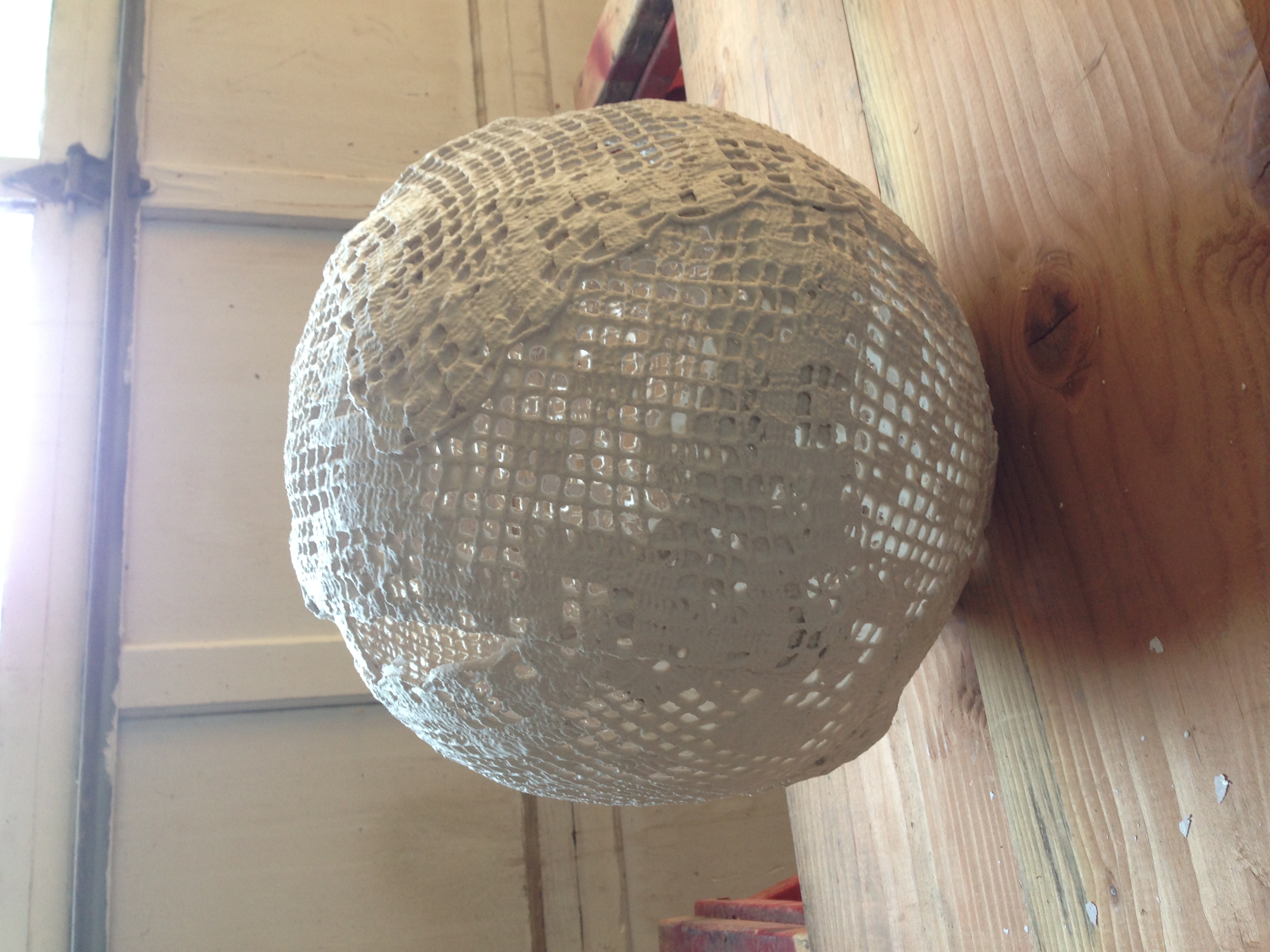 This is a lantern made of doilies, in progress.