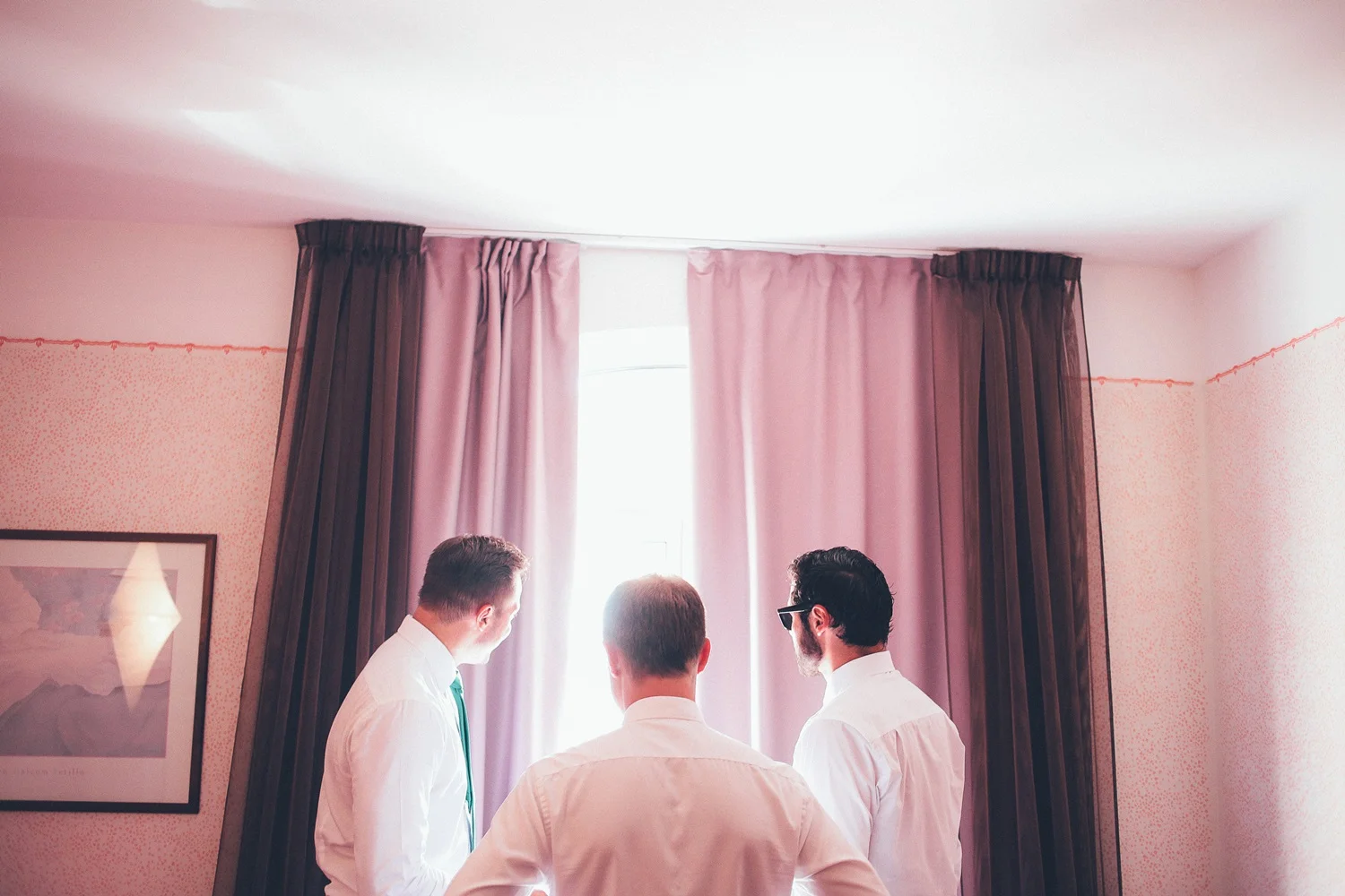 groom-getting-ready-window.jpg