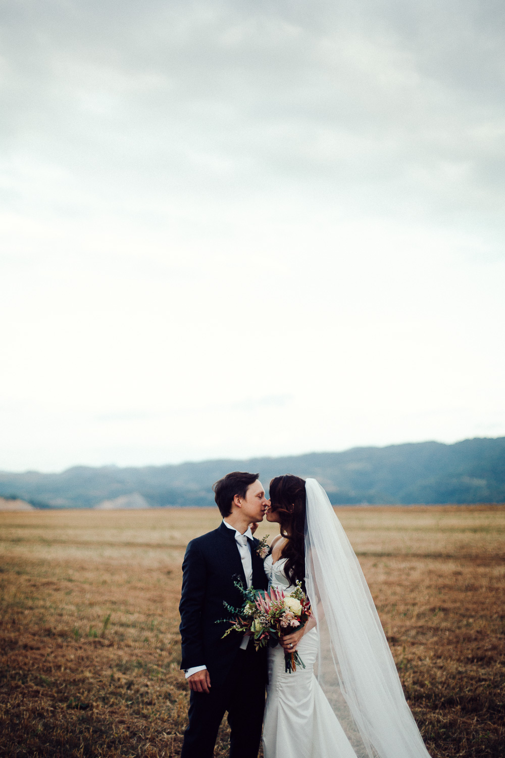 78-groom-bride-kissing.jpg