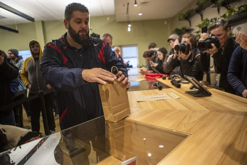Veteran Stephen Mandile, a former sergeant in the Army National Guard, made the first purchase of recreational marijuana in Massachusetts at Cultivate in Leicester, MA. (Jesse Costa/ WBUR )