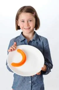 Ruby Lucken, who spends much of her free time inventing things, created the Food Cubby for kids who want plates where foods don't mush up together. Photo by Bill Brown Photography.