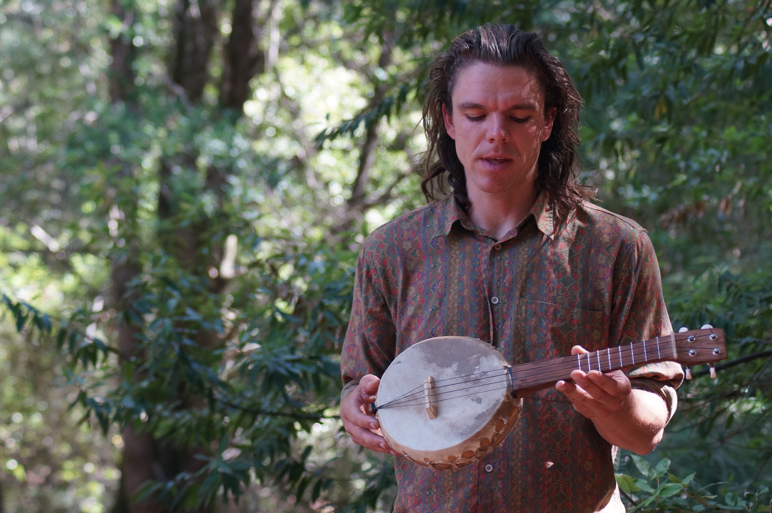 The talented Ira showing off his gourd and rawhide ukelele. Video here .