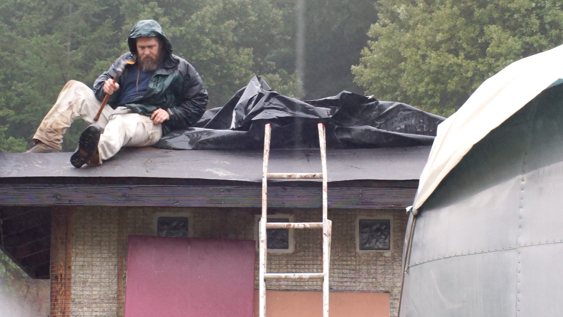 Emergency roof repairs in the rain.