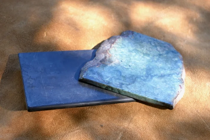 Home made slate slicker 1/4 inch thick and a slab of repurposed jade with the edges polished