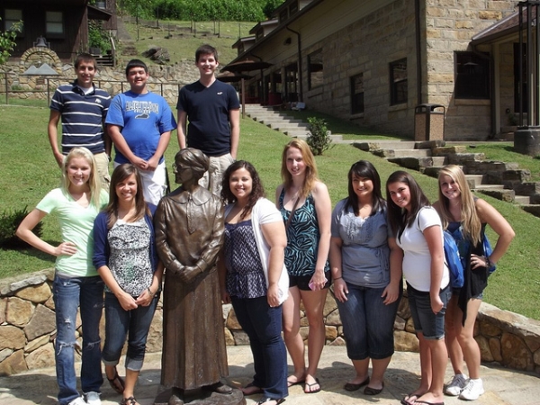 Students pose with a life-sized statue of Alice Lloyd via Flickr under CC BY-ND 2.0